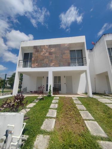 Jimenez House | House in front of the Maya Playa del Carmen train