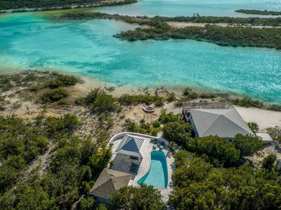 Venetian Road Settlement Villa | Modern Flamingo Lake Villa