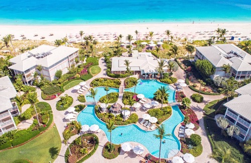 Grace Bay Condo | BEST LOCATION on Grace Bay! PLAZA at OCW, No Car Needed!