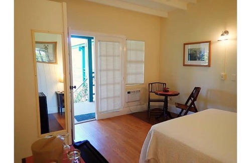 Cockburn Town House | JACKS - Grand Turk B&B Courtyard room with Queen bed - Grand Turk Island!