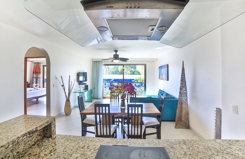 Gonzalo Guerrero Condo | Large, modern condo with balcony overlooking 5th Ave. 4 minute walk to the beach
