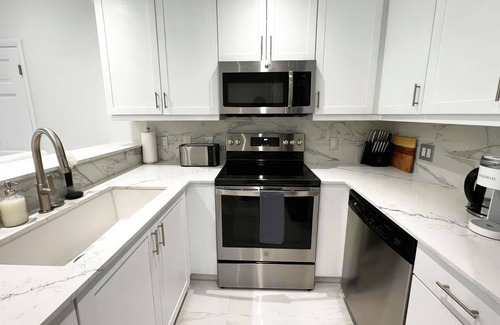Leeward Settlement Condo | New! Luxury 1Bed Large Condo - Moments from the Beach