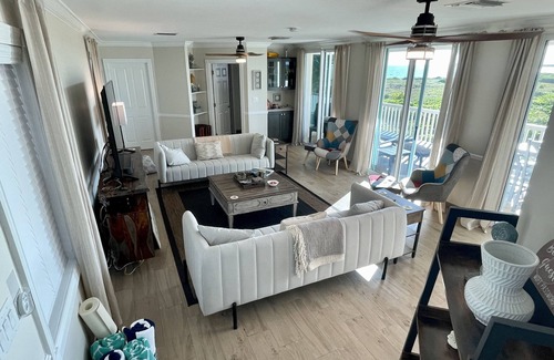 Wheeland Settlement Condo | Seas the Day TCI covered balcony, patio dining, gated entrance, on site security