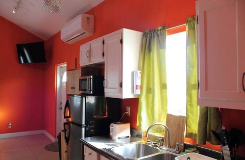 Leeward Settlement Apartment | 55 Oasis Cottage. Studio suite. Nearby World's #1 Grace Bay Beach.