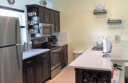 Wheeland Settlement Condo | “Coastal Bliss: Stunning 2-Bedroom Condo with breathtaking Beach and Pool Views”