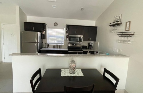 Wheeland Settlement Condo | “Coastal Bliss: Stunning 2-Bedroom Condo with breathtaking Beach and Pool Views”