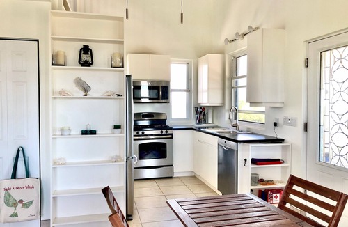 Long Bay Cottage | Flame Tree Cottage. Private home with pool and ocean view. 1/2 mile to beach