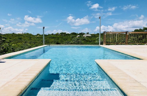 Long Bay Cottage | Flame Tree Cottage. Private home with pool and ocean view. 1/2 mile to beach