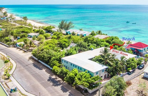 Cockburn Town House | Grand Turk Vibes - Balcony double queen room with partial ocean view!
