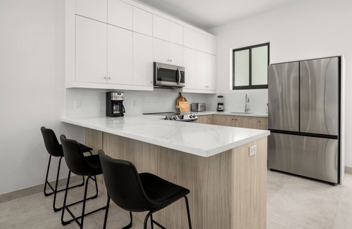 Providenciales Condo | Luxury Townhome rentals in Grace Bay - walk to beach, dining and Fish Fry