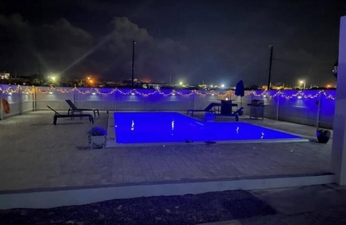 Cockburn Town House | Modern ocean villa with heated pool