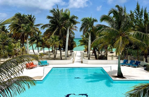 Sandy Point Villa | Oceanfront Dream Villa. Expansive pool, game room, rooftop lounge, kitchen.