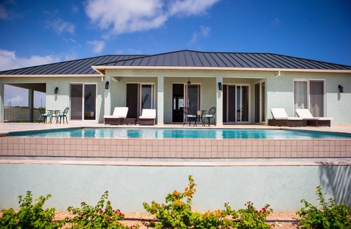 Bottle Creek Villa | Spacious Secluded Waterfront Home with compact car