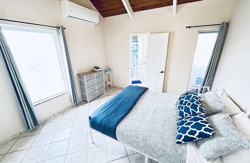 Discovery Bay House | The Flamingo House, Open & Breezy Island Home, Minutes From the Beach