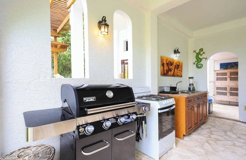 Leeward Settlement Apartment | Tropical Oasis Retreat: Romantic Upstairs Unit with Pool View and Balcony