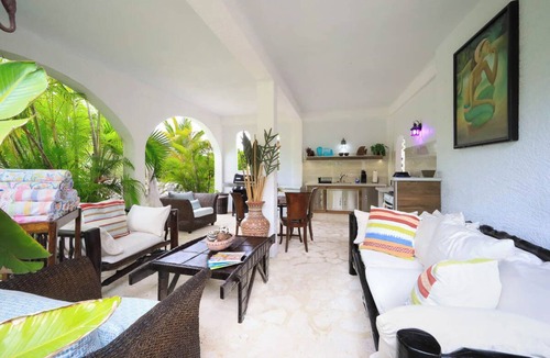 Leeward Settlement Apartment | Tropical Oasis Retreat: Romantic Upstairs Unit with Pool View and Balcony