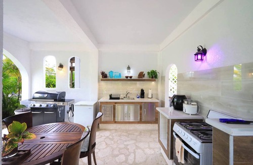 Leeward Settlement Apartment | Tropical Oasis Retreat: Romantic Upstairs Unit with Pool View and Balcony