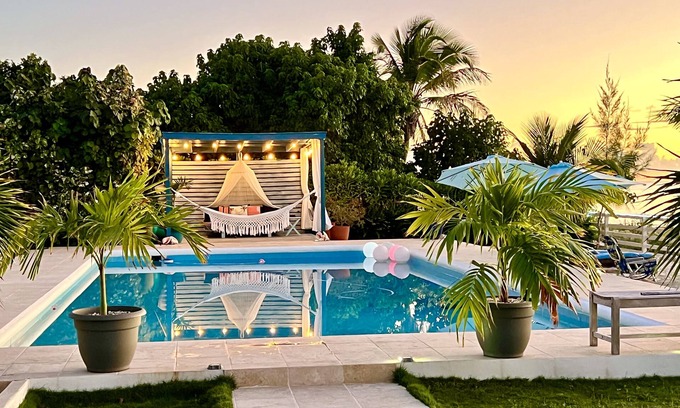 Cockburn Town Villa | Two villas side by side. Each villa has its own jacuzzi and ocean front pool.
